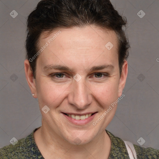 Joyful white adult male with short  brown hair and grey eyes