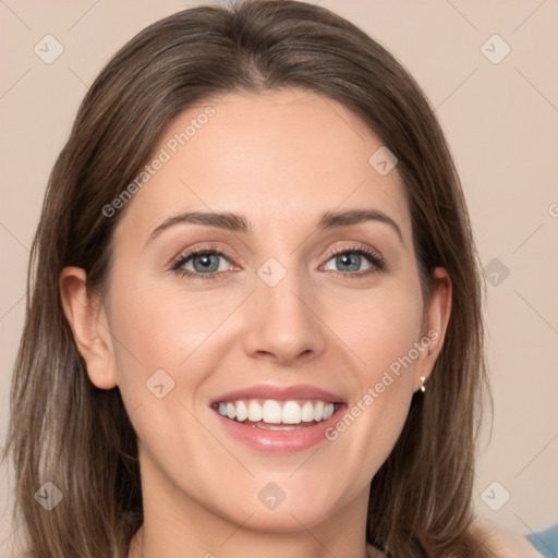 Joyful white young-adult female with long  brown hair and grey eyes