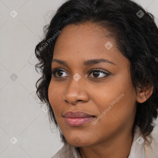 Joyful black young-adult female with medium  brown hair and brown eyes