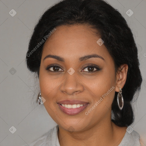 Joyful black young-adult female with long  brown hair and brown eyes