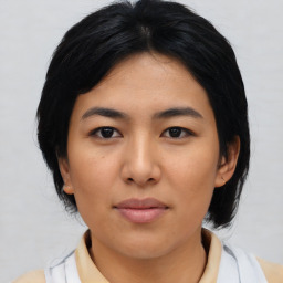 Joyful asian young-adult female with medium  black hair and brown eyes