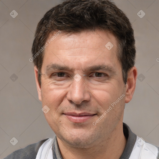 Joyful white adult male with short  brown hair and brown eyes