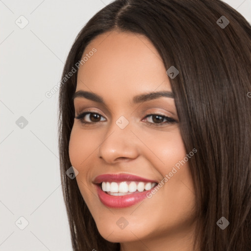 Joyful white young-adult female with long  black hair and brown eyes