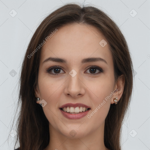 Joyful white young-adult female with long  brown hair and brown eyes