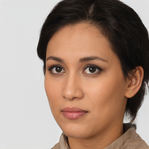 Neutral latino young-adult female with medium  brown hair and brown eyes