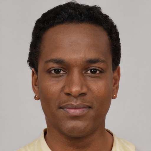 Neutral black young-adult male with short  black hair and brown eyes