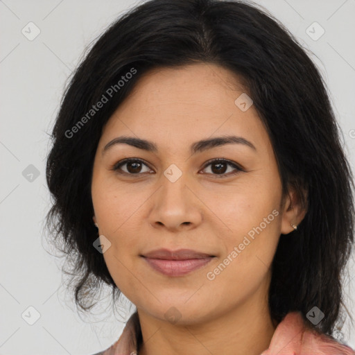 Joyful latino young-adult female with medium  brown hair and brown eyes