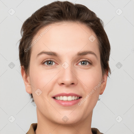 Joyful white young-adult female with short  brown hair and grey eyes