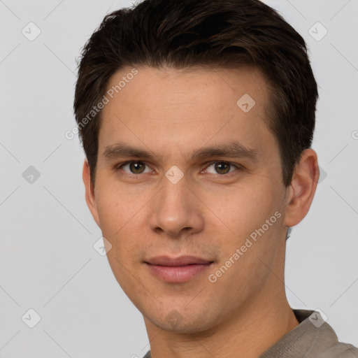 Joyful white young-adult male with short  brown hair and brown eyes