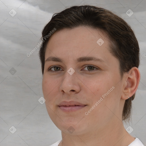 Joyful white young-adult female with short  brown hair and brown eyes