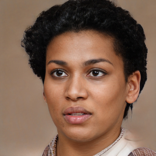 Neutral black young-adult female with medium  brown hair and brown eyes