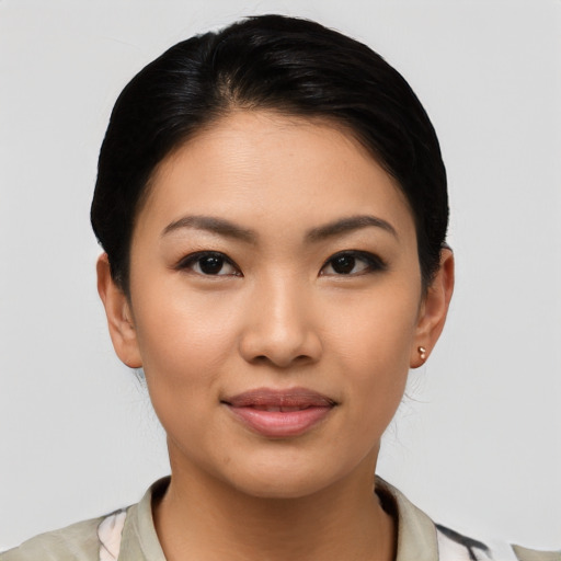 Joyful latino young-adult female with medium  black hair and brown eyes