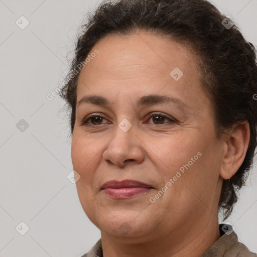 Joyful white adult female with short  brown hair and brown eyes