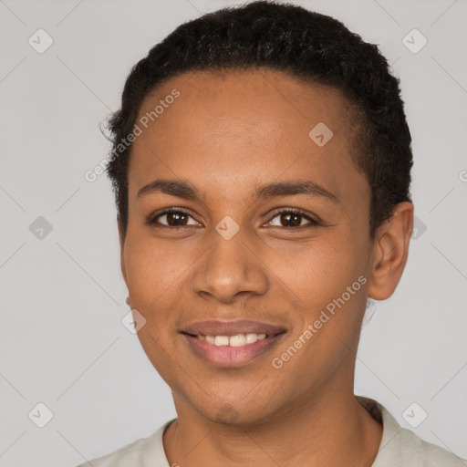 Joyful black young-adult female with short  brown hair and brown eyes