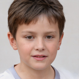 Joyful white child male with short  brown hair and brown eyes