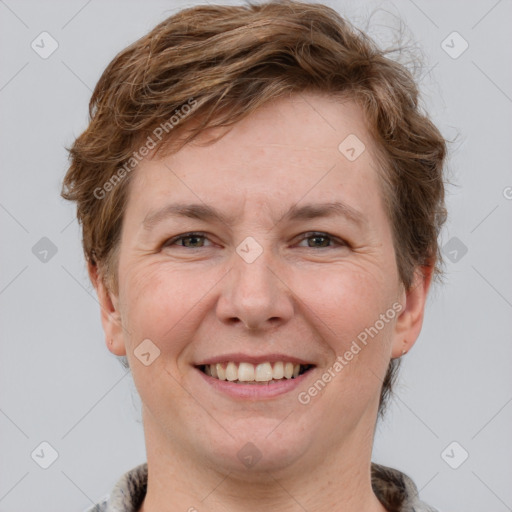 Joyful white adult male with short  brown hair and grey eyes