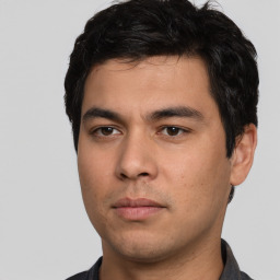 Neutral white young-adult male with short  black hair and brown eyes