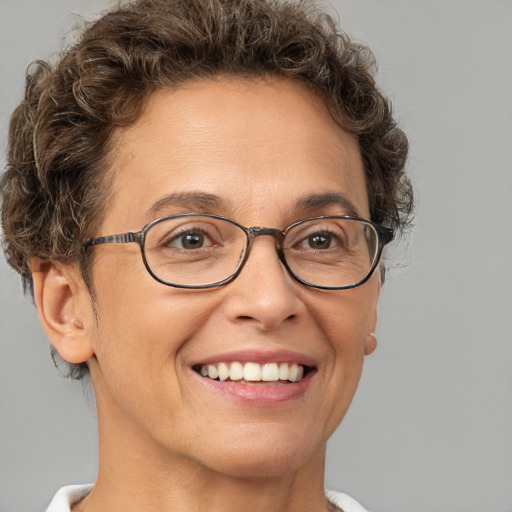 Joyful white adult female with short  brown hair and brown eyes