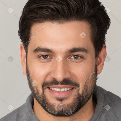 Joyful white young-adult male with short  brown hair and brown eyes