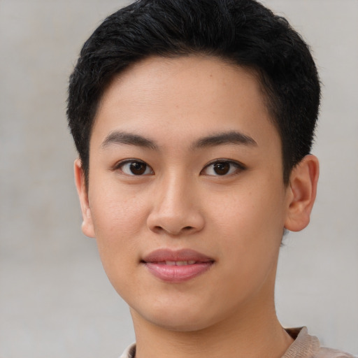 Joyful asian young-adult female with short  brown hair and brown eyes