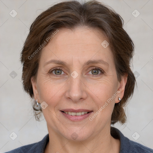 Joyful white adult female with medium  brown hair and grey eyes