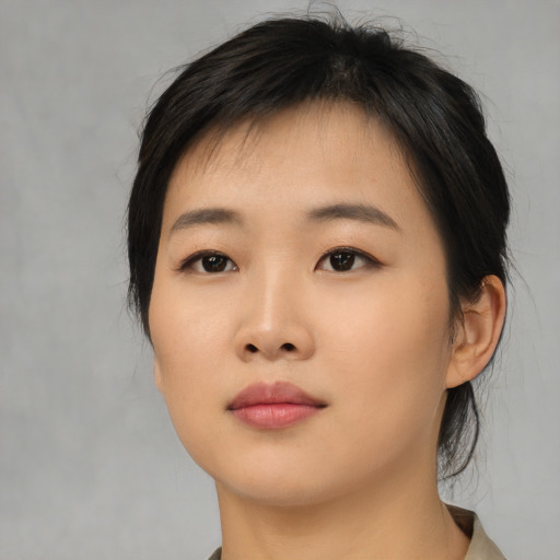 Neutral asian young-adult female with medium  black hair and brown eyes