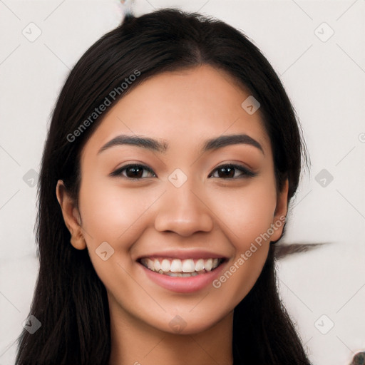 Joyful latino young-adult female with long  black hair and brown eyes