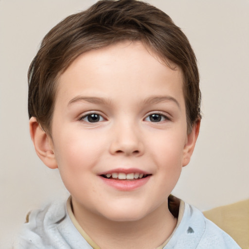 Joyful white child female with short  brown hair and brown eyes