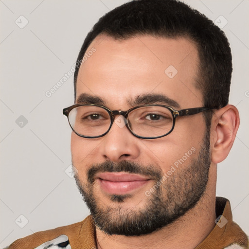 Joyful white young-adult male with short  black hair and brown eyes