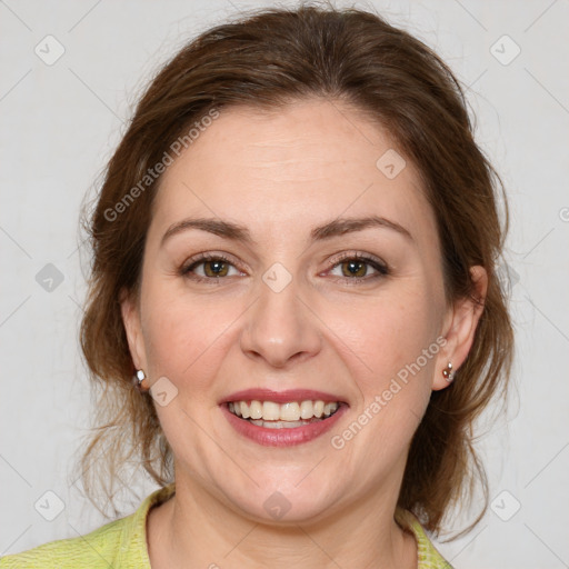 Joyful white young-adult female with medium  brown hair and green eyes