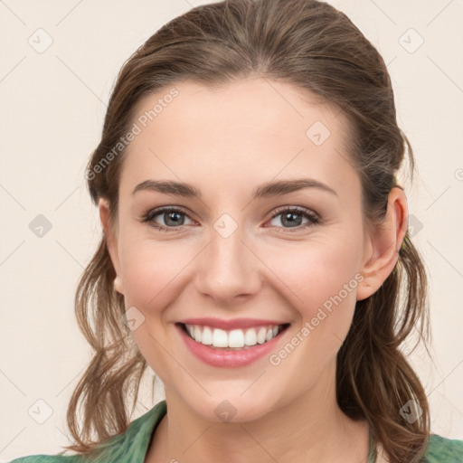 Joyful white young-adult female with medium  brown hair and green eyes