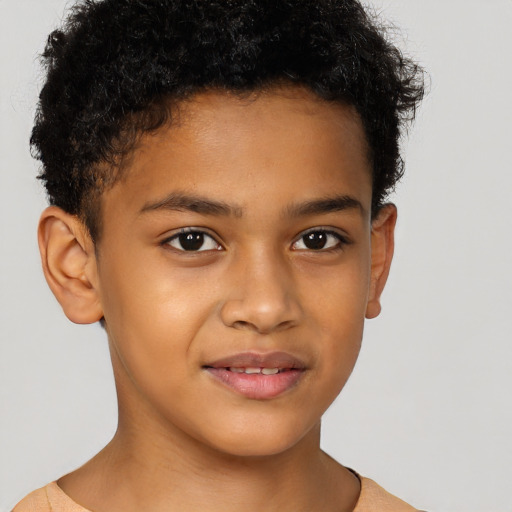 Joyful latino child male with short  brown hair and brown eyes