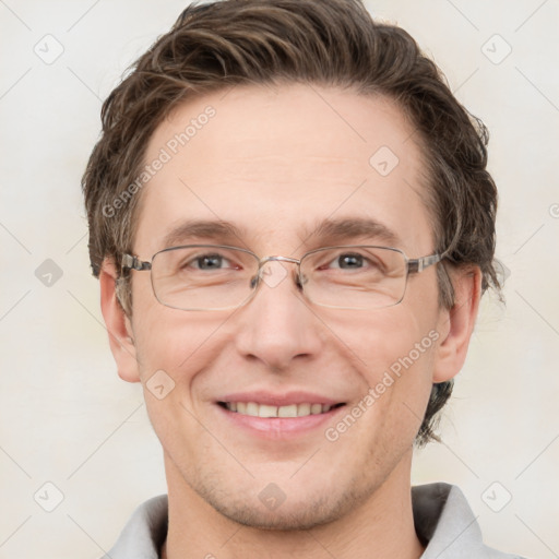 Joyful white adult male with short  brown hair and grey eyes