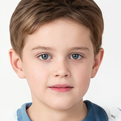 Joyful white child male with short  brown hair and grey eyes