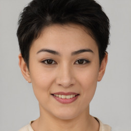 Joyful asian young-adult female with short  brown hair and brown eyes