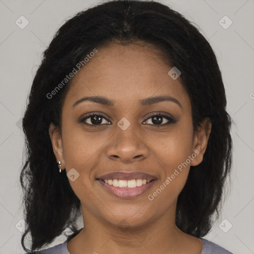 Joyful black young-adult female with medium  brown hair and brown eyes