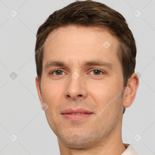 Joyful white young-adult male with short  brown hair and brown eyes