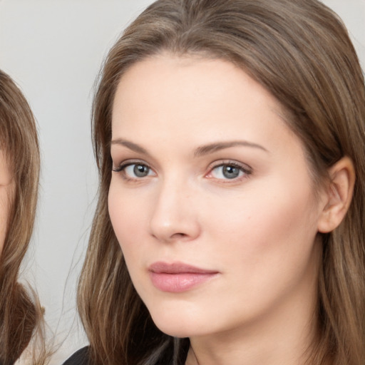 Neutral white young-adult female with medium  brown hair and brown eyes