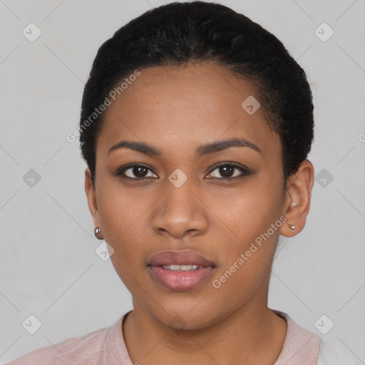 Joyful black young-adult female with short  black hair and brown eyes