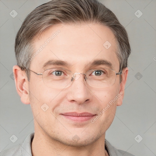 Joyful white adult male with short  brown hair and grey eyes