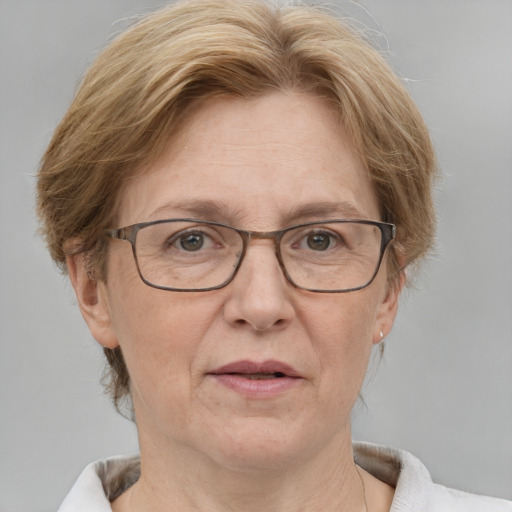 Joyful white middle-aged female with medium  brown hair and grey eyes