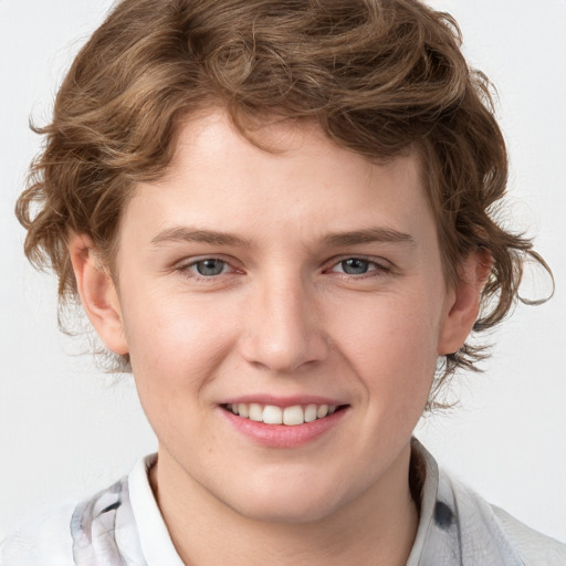 Joyful white young-adult male with medium  brown hair and blue eyes