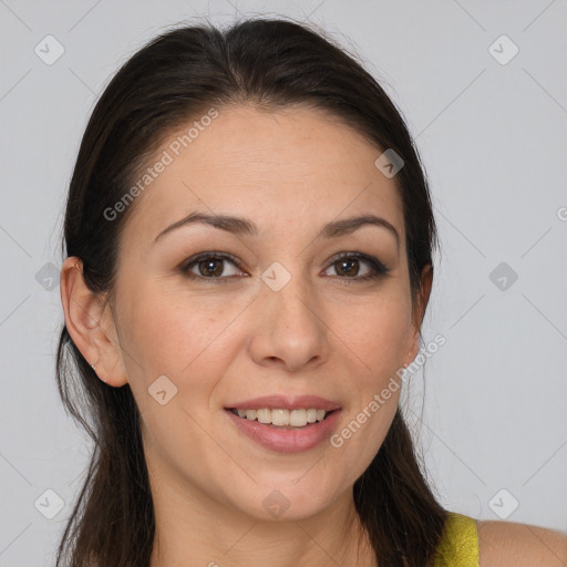 Joyful white young-adult female with long  brown hair and brown eyes