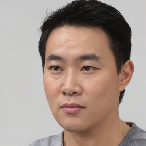 Neutral asian young-adult male with short  black hair and brown eyes