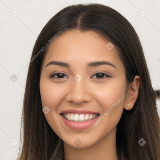 Joyful latino young-adult female with long  brown hair and brown eyes