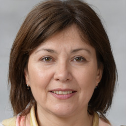 Joyful white adult female with medium  brown hair and brown eyes