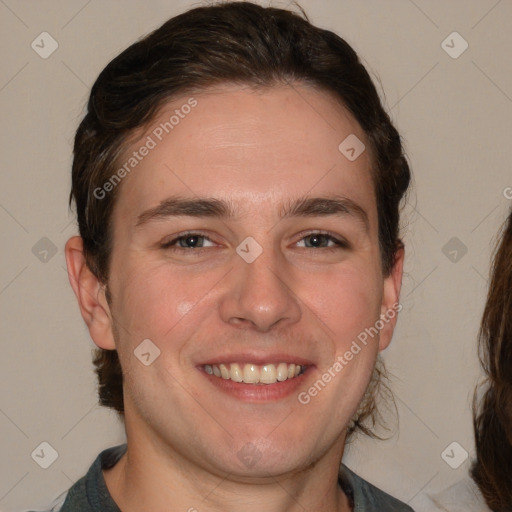 Joyful white young-adult male with medium  brown hair and brown eyes