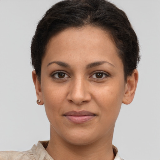 Joyful white young-adult female with short  brown hair and brown eyes