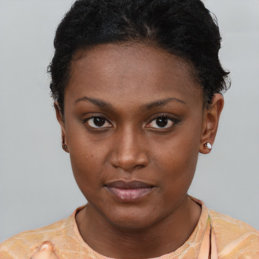 Neutral black young-adult female with short  brown hair and brown eyes