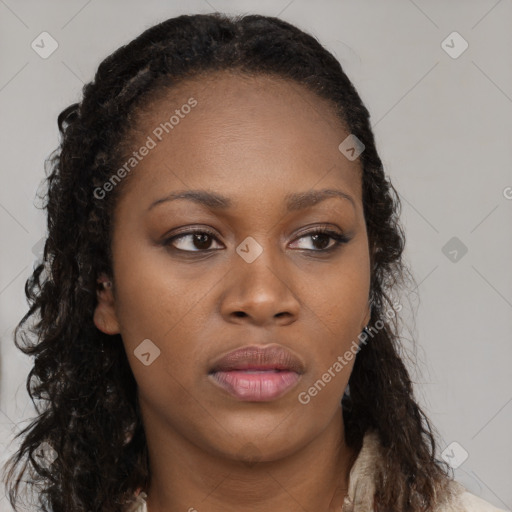 Neutral black young-adult female with long  brown hair and brown eyes